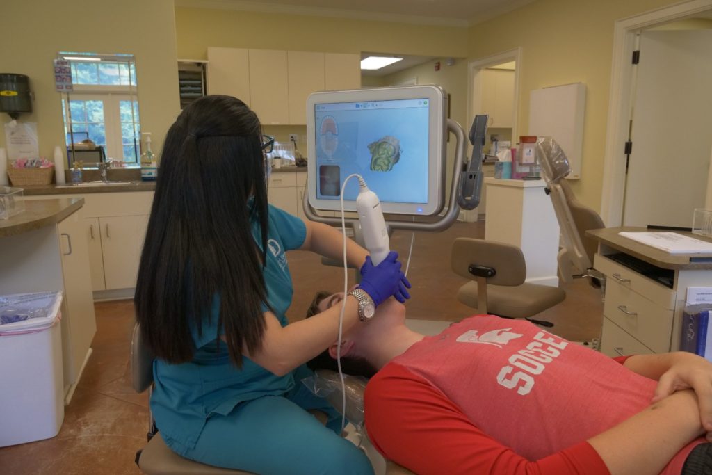 Bennett Orthodontic staff working with a patient