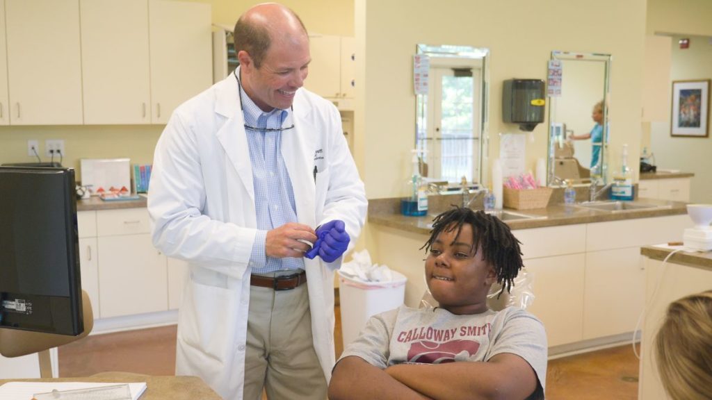 Dr. Bennett talking to a young patient
