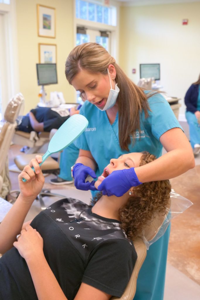 patient looking at her teeth