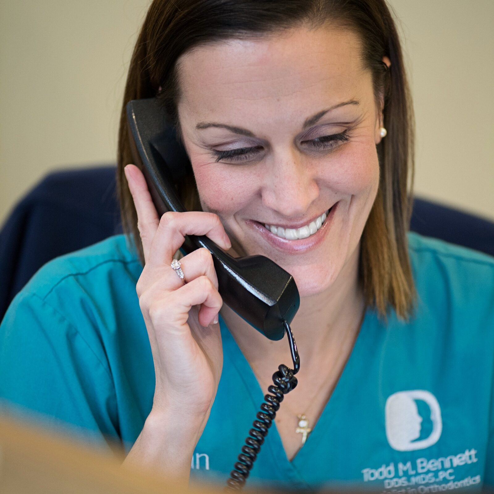 DSC_1937 Bennett Orthodontics team member on the phone